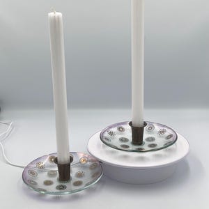A Pair of Elegant Mid-Century Dorothy Thorpe Style Candle Holders With Embedded Metallic starbursts And Gears