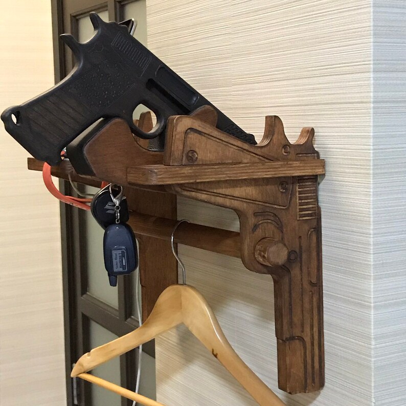 Floating nightstand with gun rack and coat rack. Charging Etsy