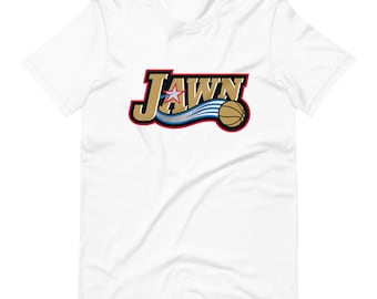 May include: White t-shirt with a gold and red logo that says "Jawn" with a basketball and a star.