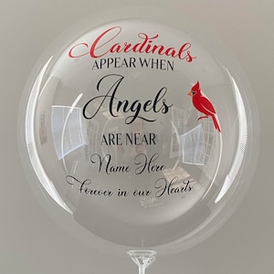 May include: A clear balloon with a red cardinal and the text "Cardinals appear when Angels are near Name Here forever in our hearts".