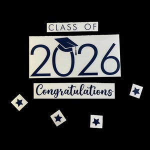 May include: White stickers with navy blue text and graphics. The stickers include the words "CLASS OF", the number "2026" with a graduation cap, and the word "Congratulations". There are also star-shaped stickers.