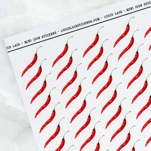 May include: A sheet of mini icon stickers featuring a repeating pattern of red chili peppers. The stickers are printed on a white background with a black border that includes the text "LUCID LAIR - MINI ICON STICKERS".