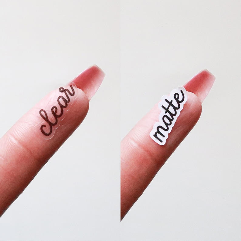 May include: Two close-up images of a finger with a long, clear nail. One nail has a sticker that says "clear" in a handwritten font. The other nail has a sticker that says "matte" in a similar font. The background is a soft, neutral color.