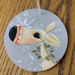 Reindeer Christmas Ornament, tole painted on a 4 inch round wooden disc, based on a Deb Mishima design