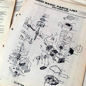 May include: An exploded diagram of engine components from a Clinton Basic Parts List. The black and white illustration shows various parts, including a carburetor, crankshaft, and fuel tank, with part numbers.