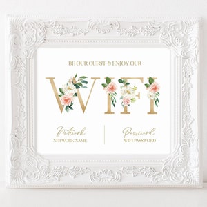 May include: A printable sign with gold floral letters spelling "WIFI" with a pink and white floral design. The sign includes spaces for the network name and password.