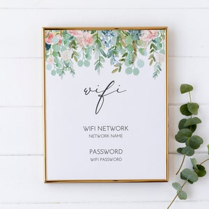 Può includere: Un cartello stampabile con un design floreale e il testo "wifi" in corsivo. Il cartello include anche il testo "WIFI NETWORK" e "PASSWORD" con spazi per il nome della rete e la password.