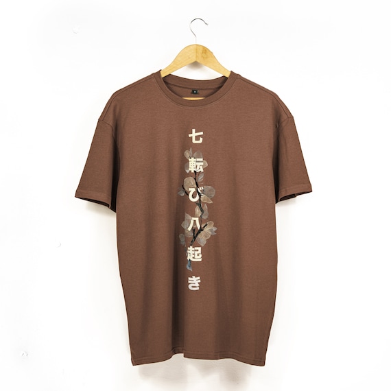 日本のことわざのオーバーサイズ バギー T シャツ | 七転び八起きの