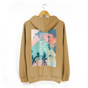 Unisex Surf Style Beach Hoodie | &#39;While We Are Young We Must Follow The Sun&#39; Tropical Print Hoodie | Pouch Pocket Comfy Hoodie