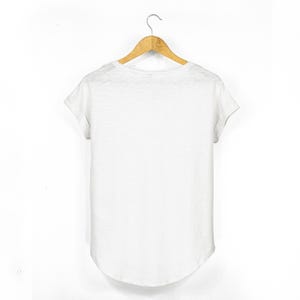 Back view of women’s white slub cotton t shirt with rolled sleeves and curved drop hem, relaxed fit and plain finish.