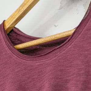 Womens semi fitted organic slub cotton tshirt with dropped rear hem. Available in cherry red.