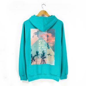 Unisex Surf Style Beach Hoodie | &#39;While We Are Young We Must Follow The Sun&#39; Tropical Print Hoodie | Pouch Pocket Comfy Hoodie