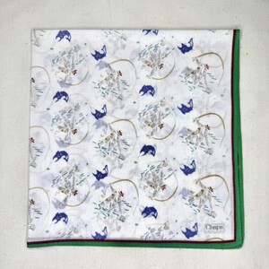 May include: White handkerchief with a repeating pattern of cowboys roping cattle, blue fish, and a lasso design. The handkerchief has a green border with a maroon accent. The brand name "Chaps" is visible in the corner.