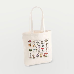 May include: A white canvas tote bag with a print of various mushrooms and the text "The Wild Harvest British Fungi".