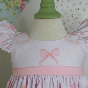 Girls Pink Twirl Dress with Bow Fabric