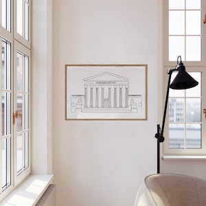 May include: A black and white line drawing of a building with columns, framed in a wooden frame and hanging on a white wall. A black lamp with a black shade is in the foreground.