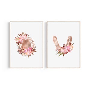May include: Two printable art prints featuring a rose gold dental mold with pink floral accents. The prints are perfect for a dentist's office or a dental themed nursery.