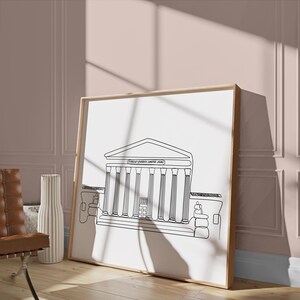 May include: A black and white line drawing of a building with columns, titled "Greek Justice Center 2024". The drawing is framed and hanging on a wall.