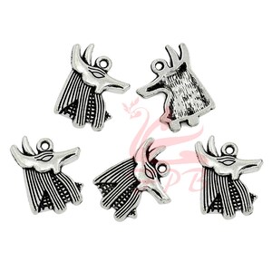 May include: Five silver-toned metal charms in the shape of an Anubis head. The charms have a detailed design and are perfect for jewelry making or crafting.