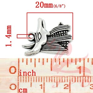 May include: Silver charm pendant featuring a detailed design of an Egyptian god with a feathered headdress. The charm measures 20mm (6/8 inches) in length and 14mm in width.