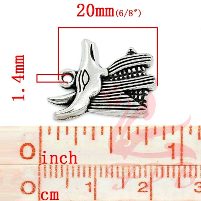 May include: Silver charm pendant featuring a detailed design of an Egyptian god with a feathered headdress. The charm measures 20mm (6/8 inches) in length and 14mm in width.