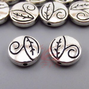 10 perline di design a foglia da 11 mm all&#39;ingrosso perline distanziatrici placcate in argento anticato SB0105241