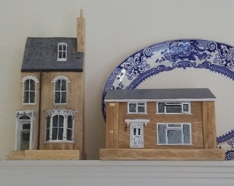 A handmade, personalised, miniature model of the front of your house, from reclaimed woods with painted features. A lifetime of memories.