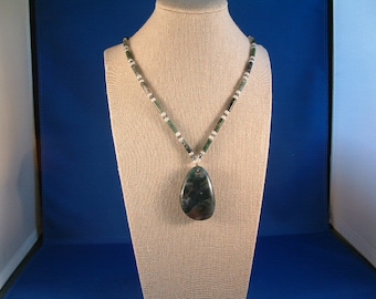 May include: A green and white agate pendant necklace with a white bead chain.