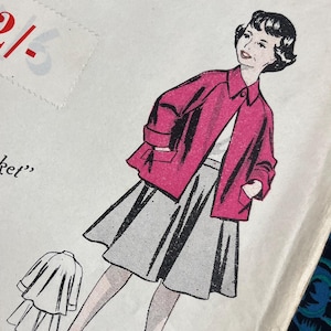 May include: Vintage paper sewing pattern titled "Shortie-Jacket" for sizes 8-10 years. The cover features a pink jacket and gray skirt illustration. The text "Practical Paper Pattern" is at the top. The price is marked as 2/-. The pattern number is 4076.