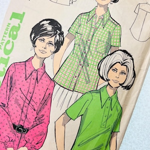 May include: A vintage sewing pattern envelope featuring illustrations of three shirts. One shirt is pink with a small black pattern, one is a green and white plaid short-sleeve shirt, and one is a solid lime green short-sleeve shirt. Text reads No. 65.
