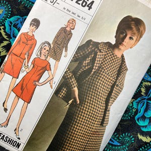 May include: A Simplicity 7264 sewing pattern envelope for a Miss size 18, bust 38 garment. The cover features illustrations of a two-piece suit and a dress, alongside a photograph of a model wearing a brown and black houndstooth jacket and skirt.