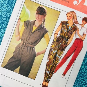 May include: Vintage sewing pattern with illustrations of women's jumpsuits. The pattern shows a jumpsuit with a brown vest and a patterned jumpsuit with a zipper. The text on the pattern reads "Style" and "Size 10, Bust 83 cm, Miss."
