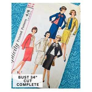 May include: A Simplicity printed pattern envelope for size 14, bust 34, featuring illustrations of four different skirt and jacket suit ensembles. The cover displays various colour combinations including red, blue, yellow, and black, with text indicating bust 34 inch.