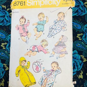 May include: Simplicity sewing pattern number 8761 for newborn baby clothes. The pattern includes instructions for making a variety of garments, including a hooded sleeper, a onesie, a dress, and a robe. The pattern is priced at £1.00.