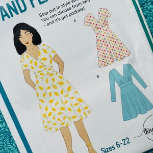 May include: A sewing pattern for a wrap and flare dress. The pattern features a drawing of a dress with a lemon print, and two other dress options. The text reads "Step out in style with this flattering dress. You can choose from two sleeve options - and it's got pockets!" Sizes 6-22.