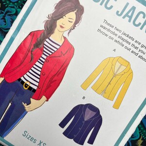 May include: A sewing pattern envelope titled CLASSIC JACKET featuring an illustration of a person wearing a red jacket over a black and white striped shirt and blue jeans. Includes technical drawings of a yellow jacket and a dark blue jacket. Sizes XS-XL.