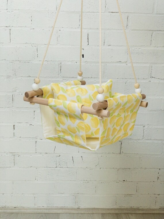grey and yellow baby swing