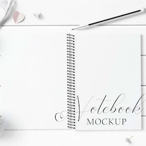 Spiral Notebook Mockup Styled with rustic white wood and paper hearts on a white wood background. Showcase your creations with ease!