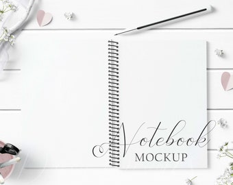 Spiral Notebook Mockup Styled with rustic white wood and paper hearts on a white wood background. Showcase your creations with ease!