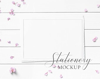 5x7 Stationery Mockup Styled with textured paper and envelope and pink flowers on a white wood background. Showcase your creations!