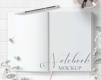 Open Notebook Mockup Styled with flowers, blush accent and white pencil on a white wood background. Showcase your creations with ease!
