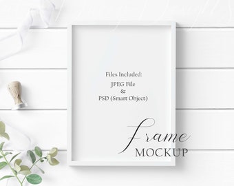 5x7 White Wood Frame Mockup with greenery and stamp sealer on a white wood background in both JPEG & PSD (Smart Object) formats.