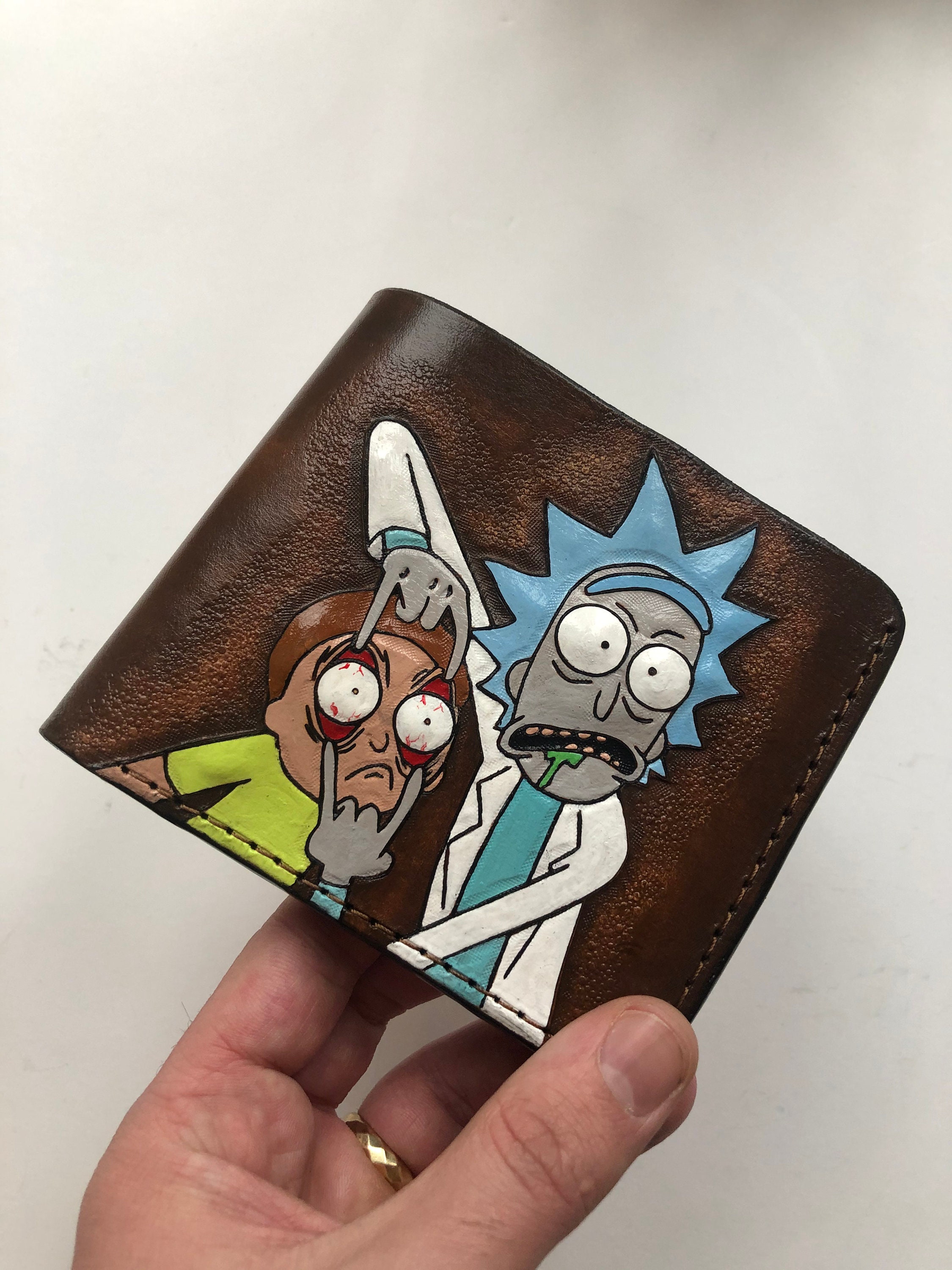 I upcycled a leather wallet by painting some portal stuffs : r/rickandmorty