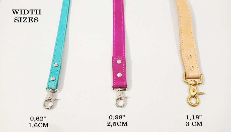 May include: Three leather straps in turquoise, fuchsia, and tan, each with a metal clasp. The turquoise strap is 0.62 inches (1.6 cm) wide, the fuchsia strap is 0.98 inches (2.5 cm) wide, and the tan strap is 1.18 inches (3 cm) wide. The text "WIDTH SIZES" is at the top.