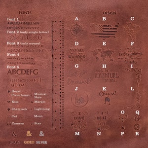 May include: A brown leather journal with a variety of stamped designs, including a compass, a map, a heart, a cat, a camera, and the words "Let's travel".