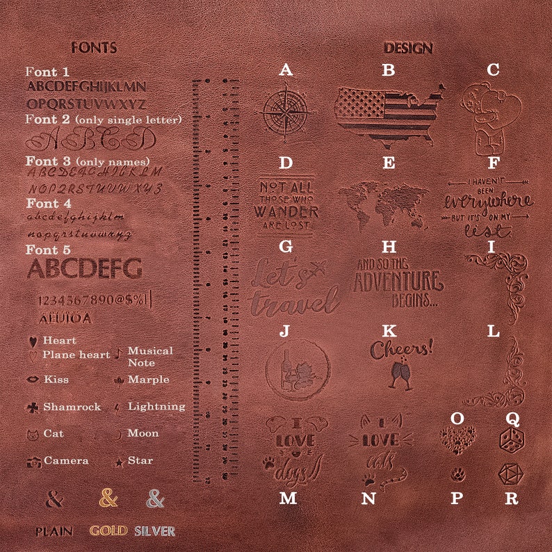 May include: A brown leather journal with a variety of stamped designs, including a compass, a map, a heart, a cat, a camera, and the words "Let's travel".
