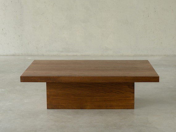 Pedestal wood coffee table deals