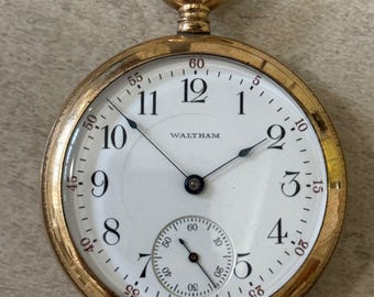 Reloj de bolsillo dorado Waltham