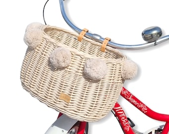 Wiklibox wicker bike basket DUMPY in ECRU (creamy) color mounted on belts with pompoms (many variants). Polish product