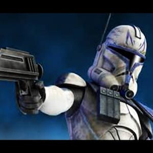 May include: A blue and white Star Wars clone trooper action figure holding a black blaster pistol. The figure is wearing a helmet with a blue visor and has a blue and white armour design.